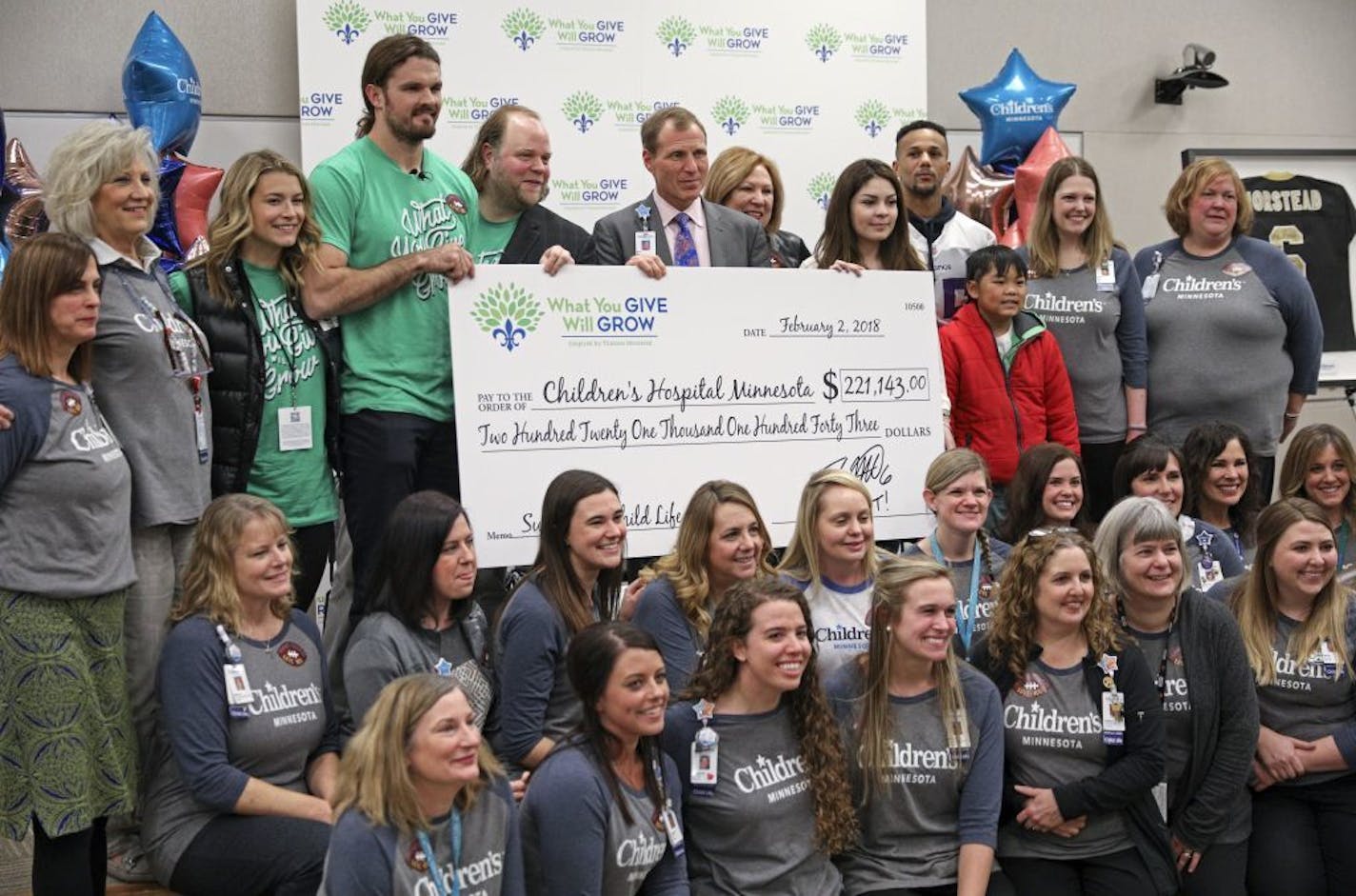 New Orleans Saints punter Thomas Morstead delivered a check for $221,143 to Children's Hospital Minnesota for all the donations Minnesotans gave to his foundation in New Orleans. Here, Child Life and Childrens Hospital staff with Morstead.