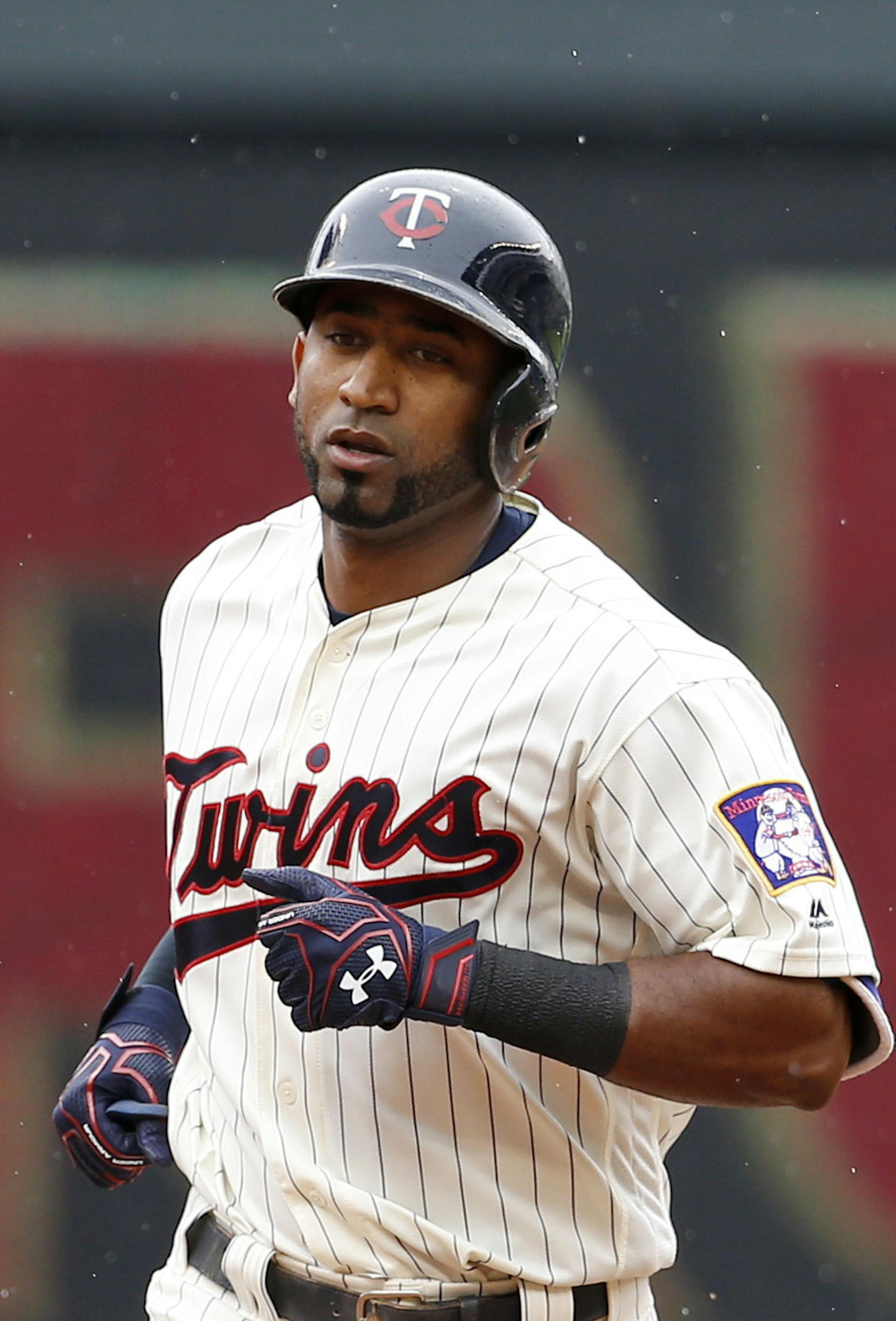 Minnesota Twins' Eduardo Nunez rounds the bases after hitting a solo home run off Kansas City Royals starting pitcher Dillon Gee during the first inning of a baseball game in Minneapolis, Wednesday, May 25, 2016. (AP Photo/Ann Heisenfelt)