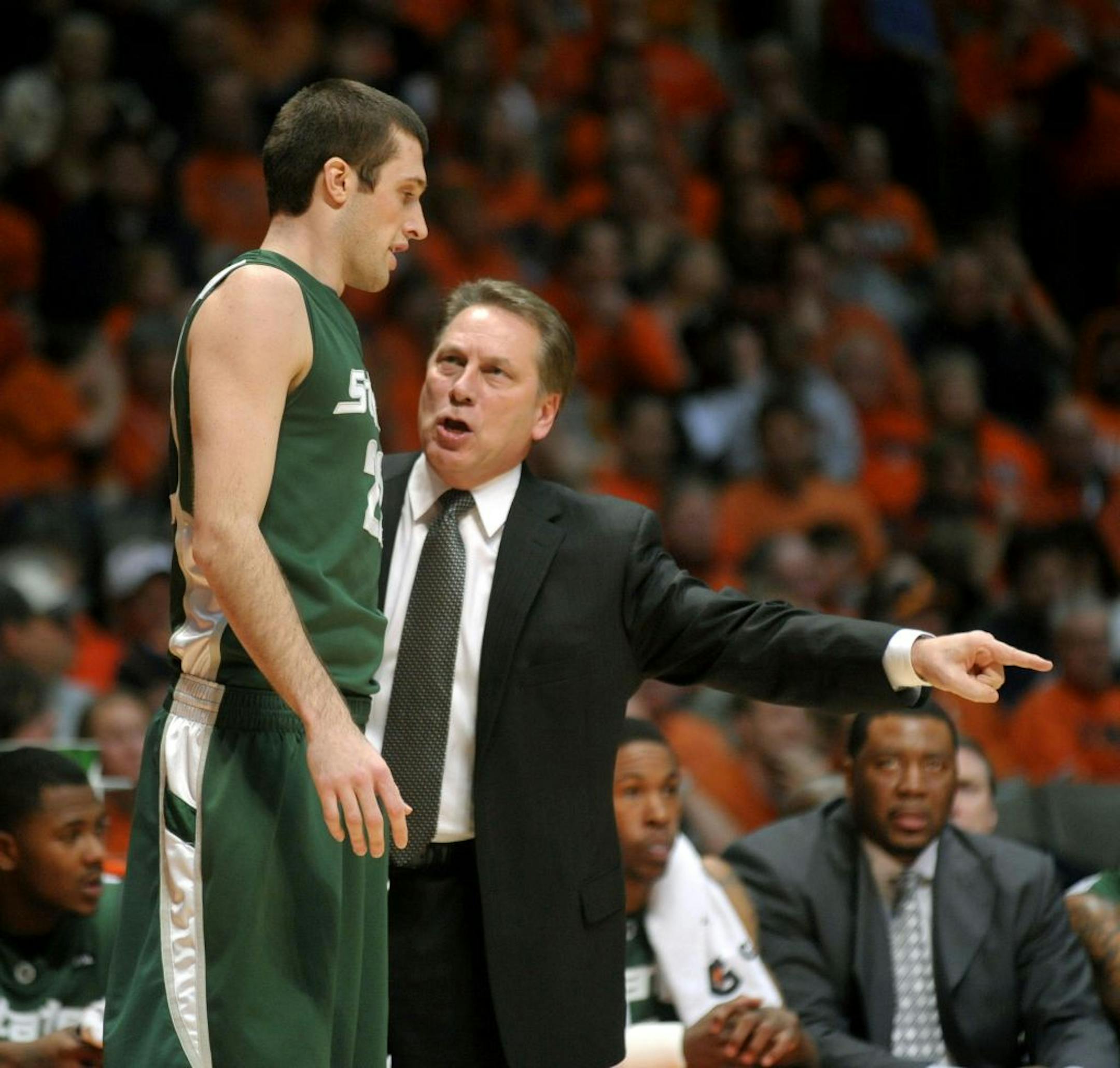Michigan State coach Tom Izzo instructed Braham, Minn., native Isaiah Dahlman as he entered a game against Illinois in February 2010. "He has built this into an elite program with blue-collar players," Dahlman said.