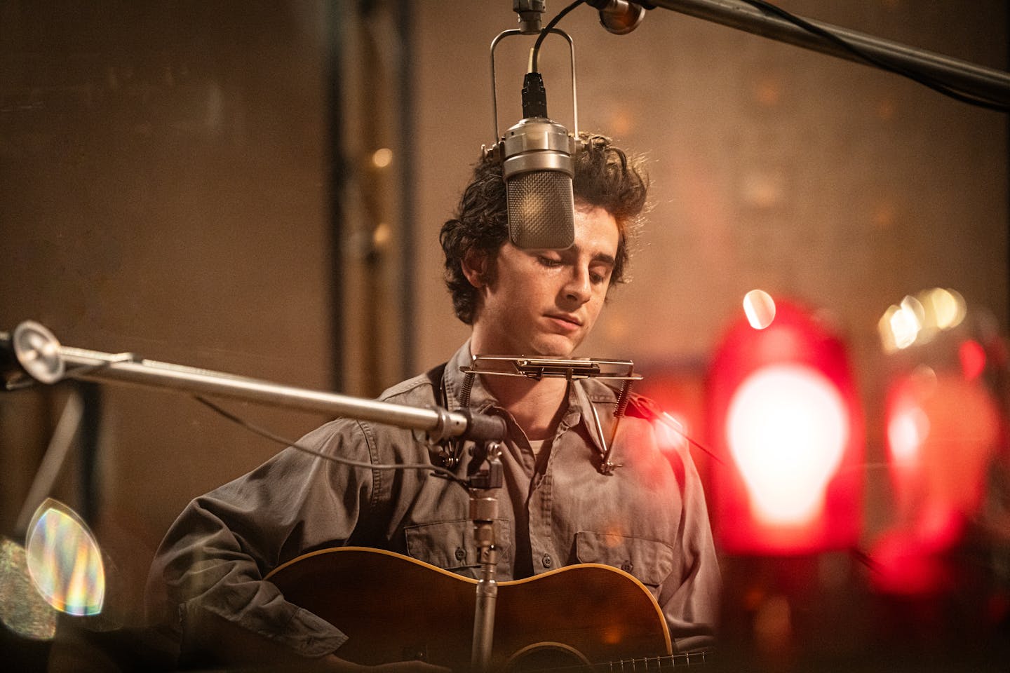 photo of Timothee Chalamet as Bob Dylan, in an early recording session