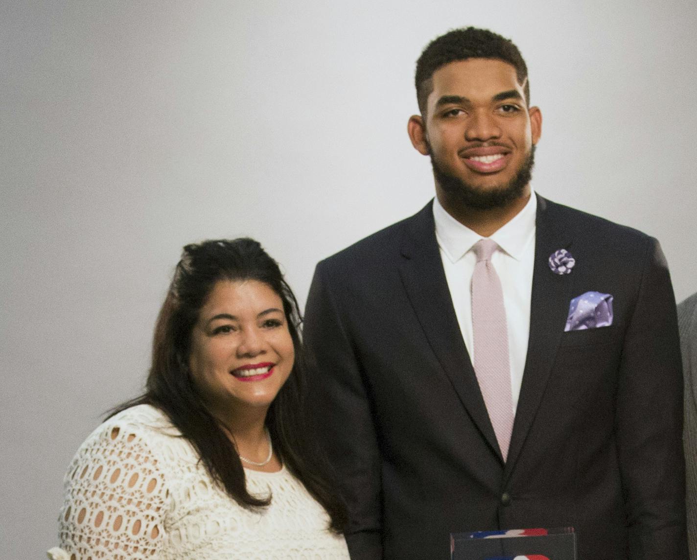 Karl-Anthony Towns poses for a portrait with his family by Timberwolves team Photographer David Sherman before the announcement of his NBA Rookie of the Year Award. From left, mother Jacqueline Cruz, niece Jolani Ammons, father Karl, nephew Anthony Maximilian Ammons, and sister, Lachelle. A day in the life of Karl-Anthony Towns before and after his Rookie of the Year day. Brian.Peterson@startribune.com Minneapolis, MN - 05/16/2016