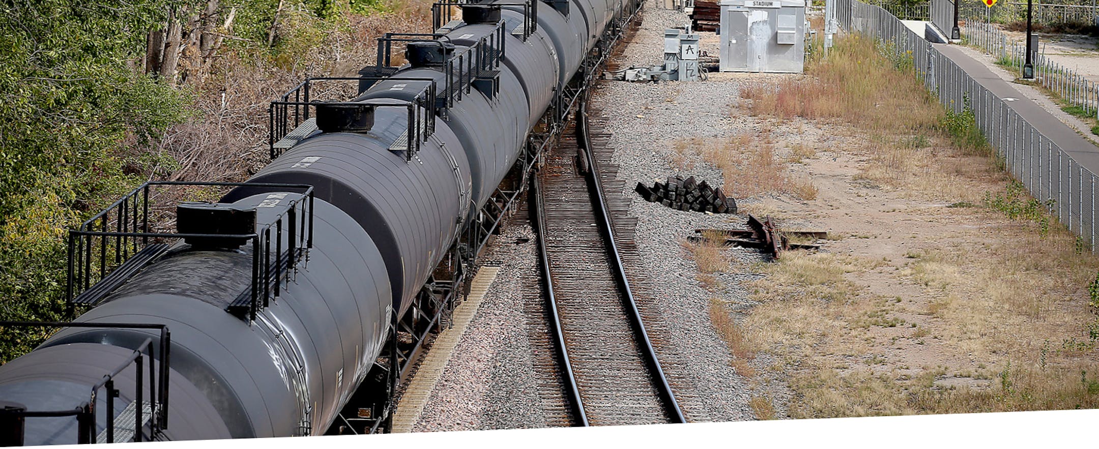 A train made its way along the tracks near downtown Minneapolis, MN, Tuesday, Oct. 6, 2015. growing number of trains that each carry at least 1 million gallons of oil from North Dakota have been entering the Twin Cities via the western suburbs on a route that sends them and their hazardous cargo through downtown Minneapolis. (Elizabeth Flores/Star Tribune via AP) MANDATORY CREDIT; ST. PAUL PIONEER PRESS OUT; MAGS OUT; TWIN CITIES LOCAL TELEVISION OUT ORG XMIT: MIN2015102919011314