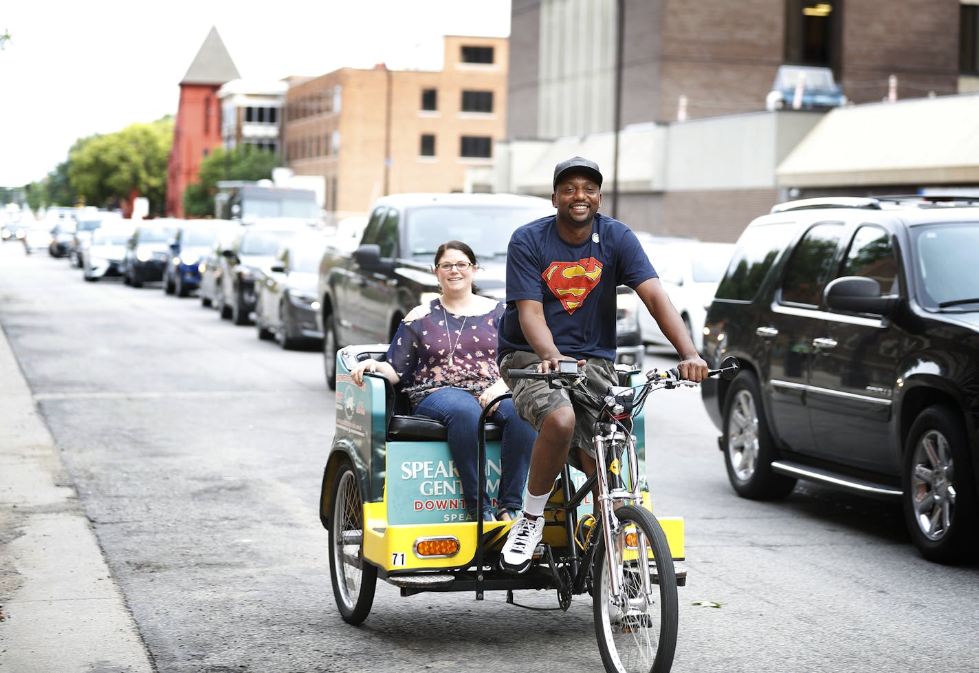 Pedicab driver Davis Powell poses for a photo inside his pedicab with rider Doreen Rusk. ] LEILA NAVIDI &#xef; leila.navidi@startribune.com BACKGROUND INFORMATION: Davis Powell rides his pedicab in downtown Minneapolis on Friday, August 31, 2018. Davis Powell, four years ago, a Minnesota prison inmate, quit his three-year, $15-an-hour job fixing tires in Savage earlier this year, over the protestations of his boss. He's doing better as a "Pedicab" entrepreneur, which is a good thing for a guy wh