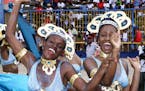 Two unidentified revelers dance during the Kadooment Parade in Bridgetown, Barbados, Monday, August 2, 1999. The Kadooment Day Parade is an annual eve