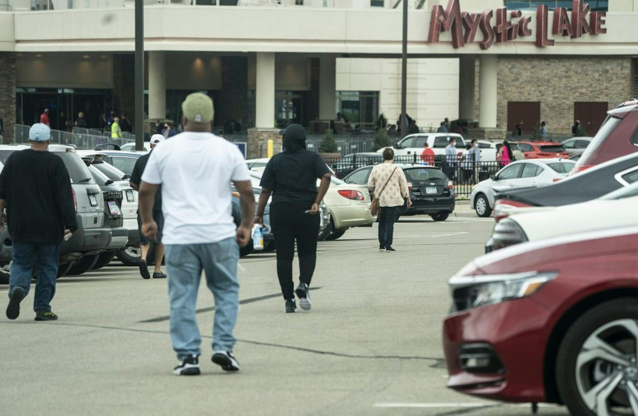 People walked into the Mystic Lake Casino in Shakopee, Minn., on Tuesday, May 26, 2020 on the first day it reopened after COVID-19 shut it down two months ago.