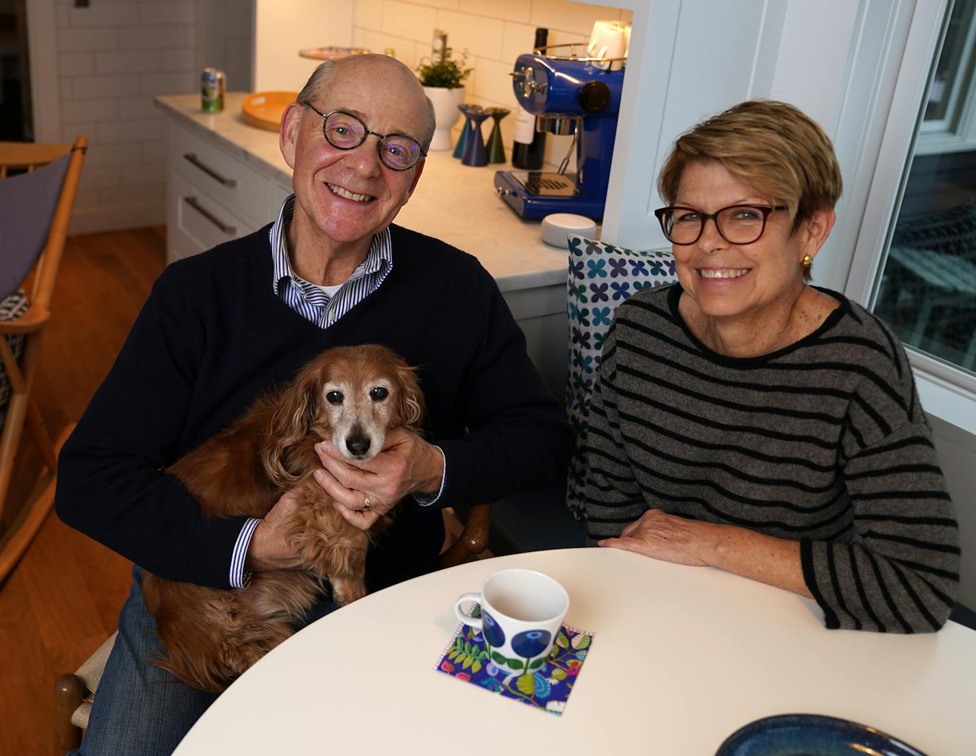 Glenn and Cheryl Seefeldt, with their dog Willie, in their remodeled kitchen.