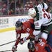 Minnesota Wild right wing Nino Niederreiter (22) collides with Washington Capitals left wing Jakub Vrana (13), of the Czech Republic, and right wing T
