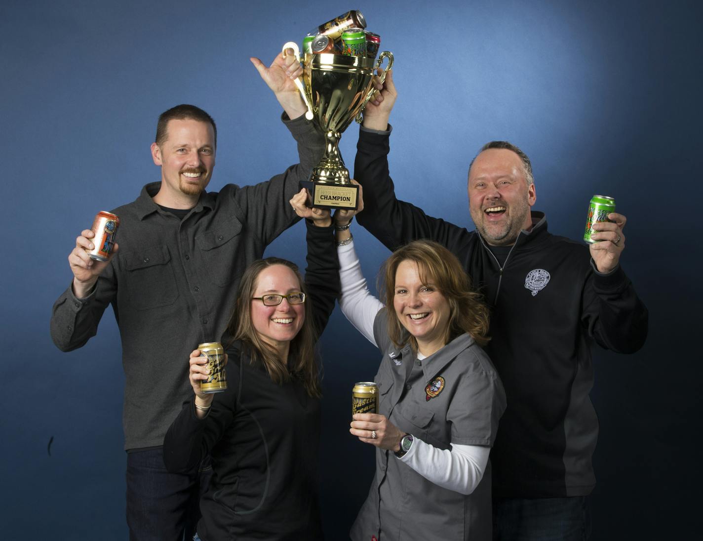 Castle Danger Brewery owners, from left to right, Clint MacFarlane, Jamie MacFarlane, Mandy Larson and Lon Larson held the Star Tribune Beer Bracket trophy for a photo on April 4, 2018 in Minneapolis, Minn. ] RENEE JONES SCHNEIDER &#x2022; renee.jones@startribune.com