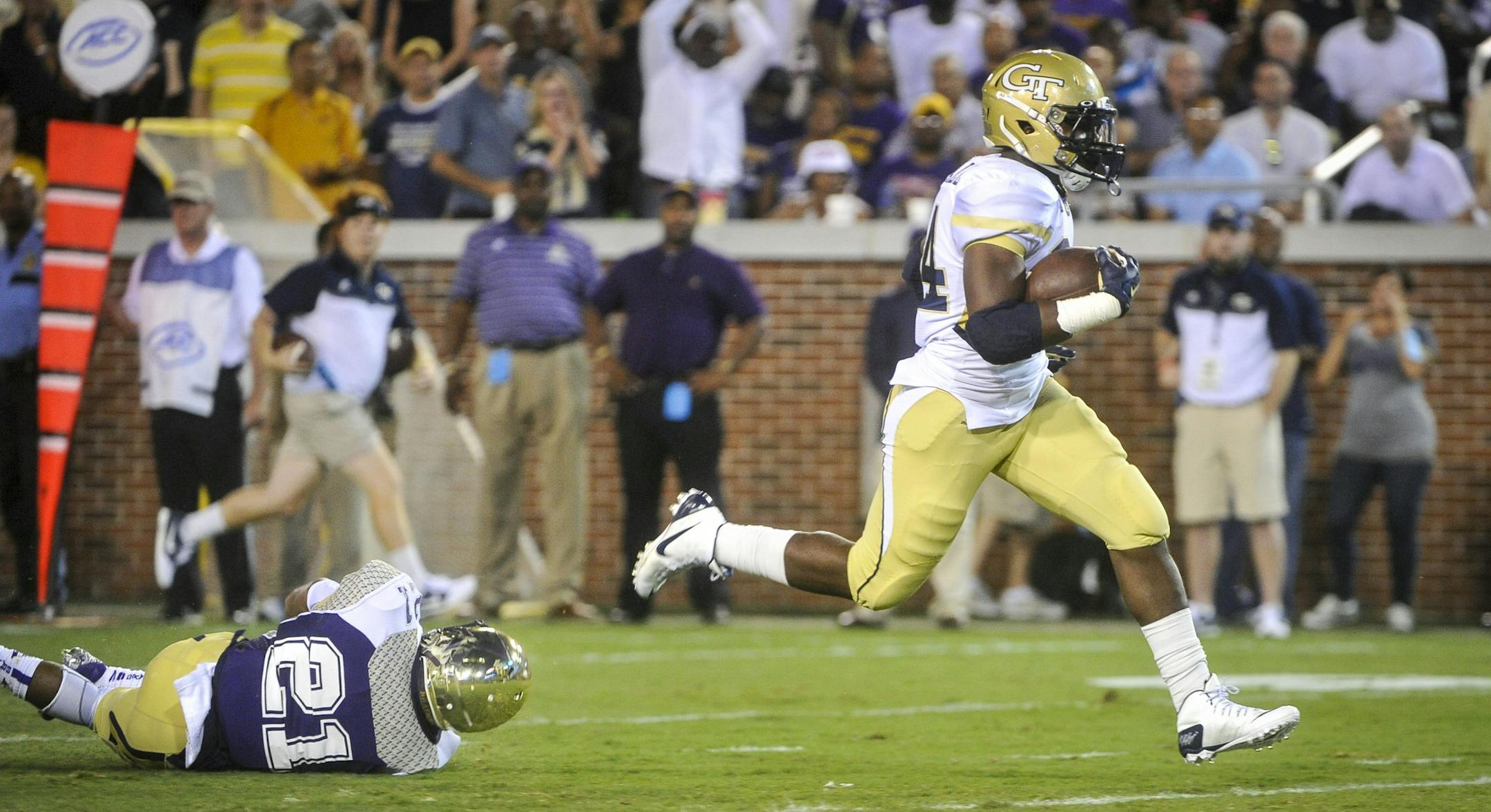 Georgia Tech running back Marcus Marshall (34) gets away from Alcorn State defensive back Quinton Cantue (21) as he runs for a touchdown during the first quarter of an NCAA college football game, Thursday, Sept. 3, 2015, in Atlanta. (AP Photo/John Amis)