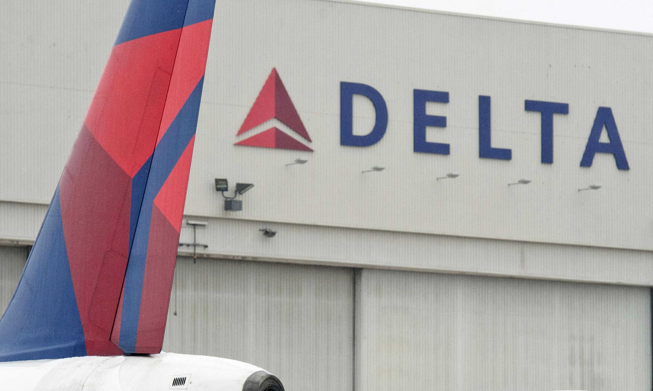 A Delta Airlines maintenance crew worked on the rear of a Delta jet Wednesday, February 29, 2012 in front of Building C where some of the warehouse operations are located. Delta Airlines announced it was moving its warehouse operations to Atlanta taking as many as 150 jobs there. ] GLEN STUBBE * gstubbe@startribune.com ORG XMIT: MIN2013022015340951