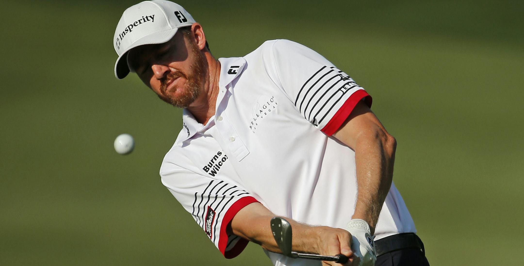 Jimmy Walker chips to the 15th green during the second round of the PGA Championship golf tournament at Baltusrol Golf Club in Springfield, N.J., Friday, July 29, 2016. (AP Photo/Mike Groll)