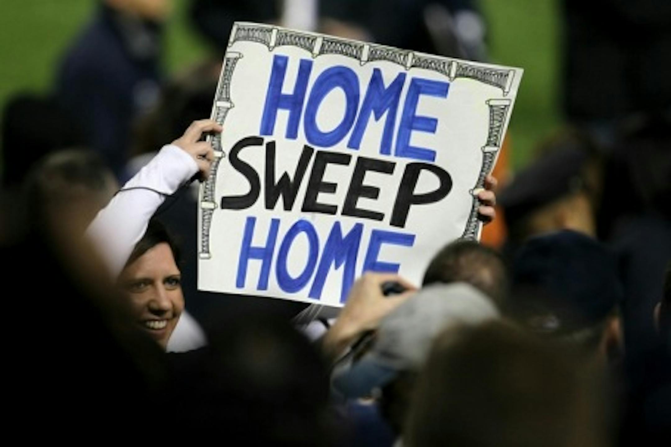 NEW YORK - OCTOBER 09:  A fan of the New York Yankees holds up a sign which reads "Home Sweep Home" after the Yankees won 6-1 against the Minnesota Twins during Game Three of the ALDS part of the 2010 MLB Playoffs at Yankee Stadium on October 9, 2010 in the Bronx borough of New York City.  (Photo by Chris McGrath/Getty Images)
