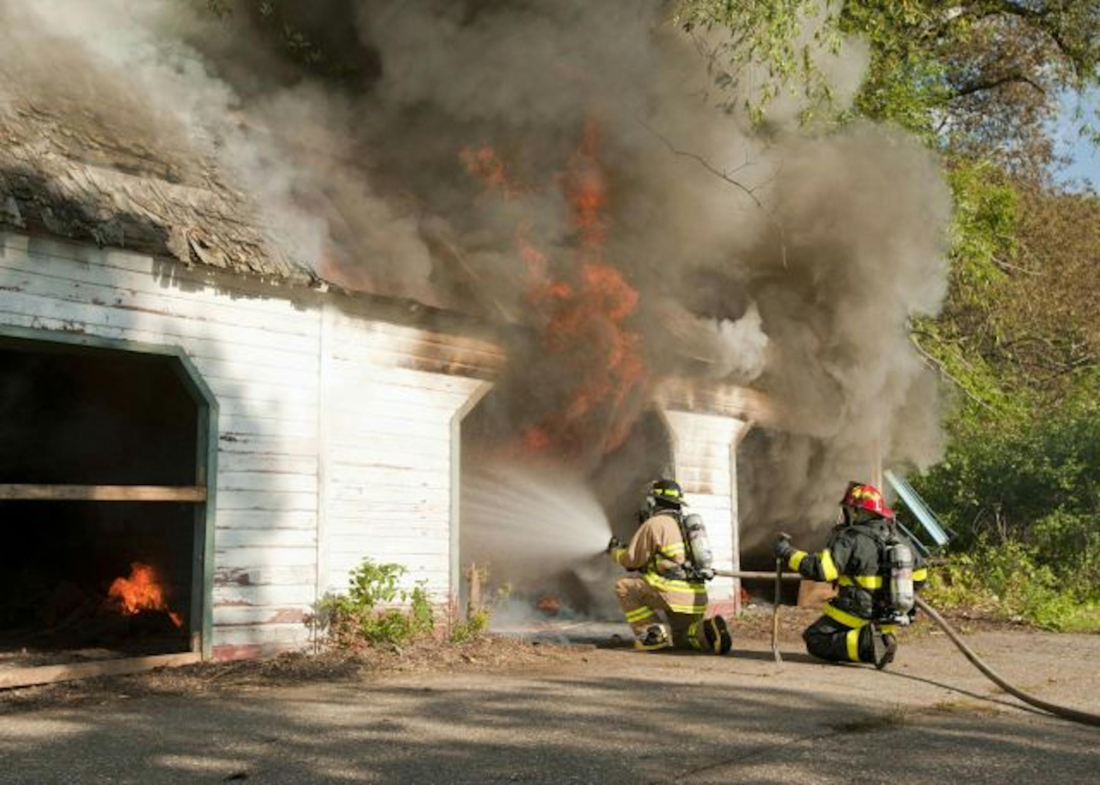 Fire fighters quickly doused a fire in an abandoned, Rockford, Minn, garage in a demonstration of a new bio-based fire retardant developed by Minneapolis-based EarthClean as a cheaper, safer alternative to chemical foams. The demonstration was organized by EarthClean and staffed and supervised by several Twin Cities-area fire departments.