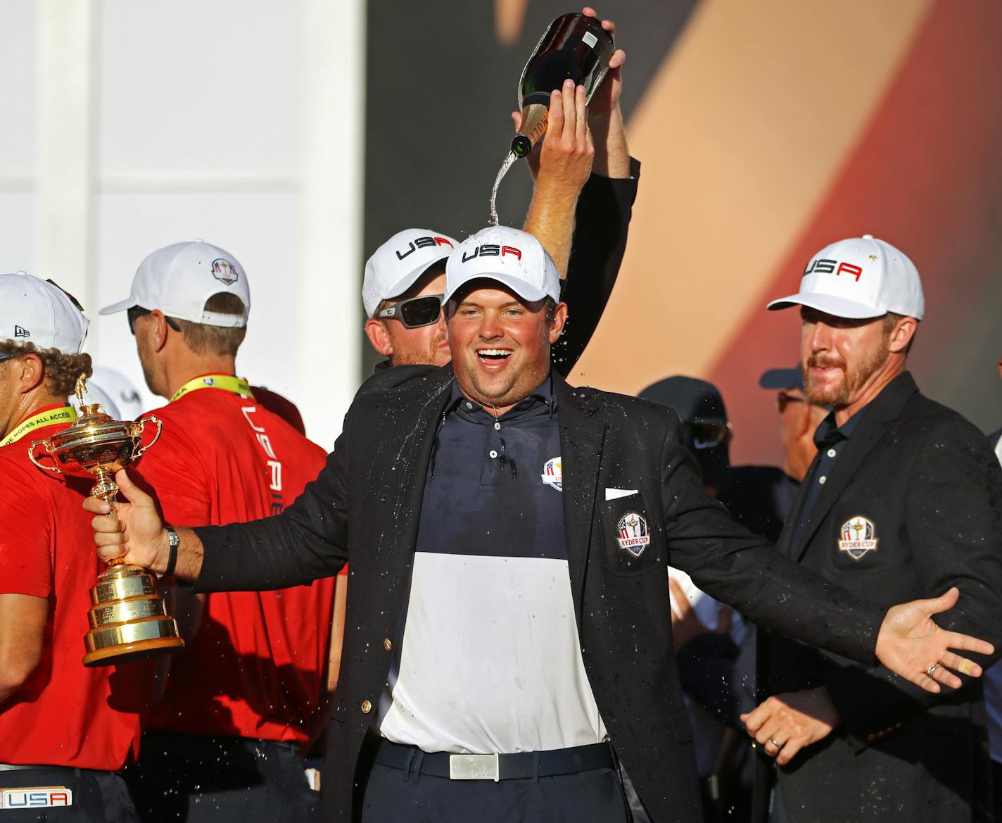 Patrick Reed with the cup and a champaigne shower by Ryan Moore. ] 2016 Ryder Cup, Hazeltine National Golf Club.
brian.peterson@startribune.com
Chaska, MN 10/02/16