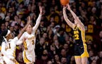 Gophers defenders arrived too late to stop Hawkeyes star Caitlin Clark from shooting and making a three-pointer in the second quarter of Iowa's 108-60
