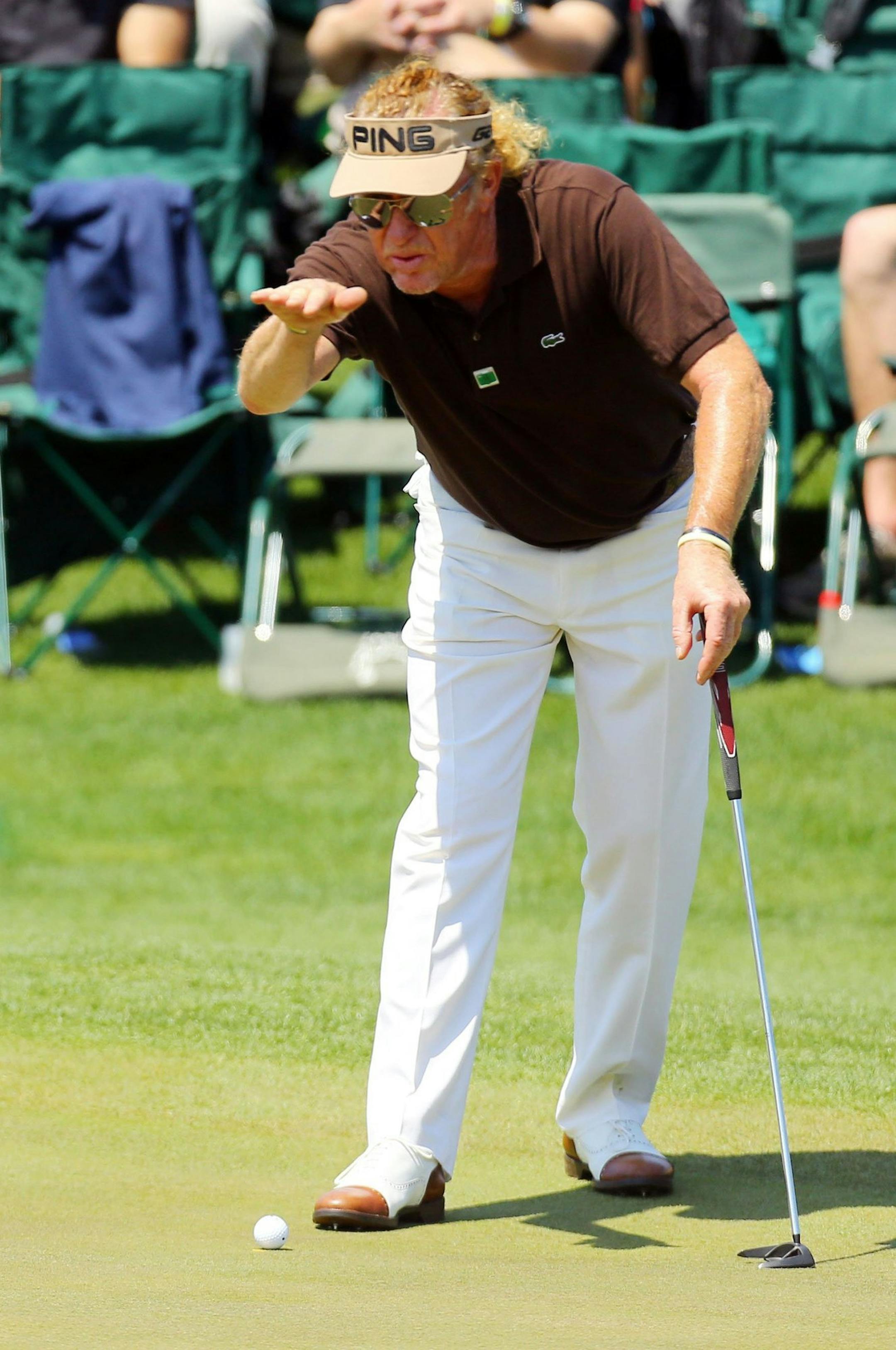 Miguel Angel Jimenez looks over his birdie attempt on the 18th green during the third round at the Masters Tournament in Augusta, Ga., Saturday, April 12, 2014. (Curtis Compton/Atlanta Journal-Constitution/MCT) ORG XMIT: 1151628