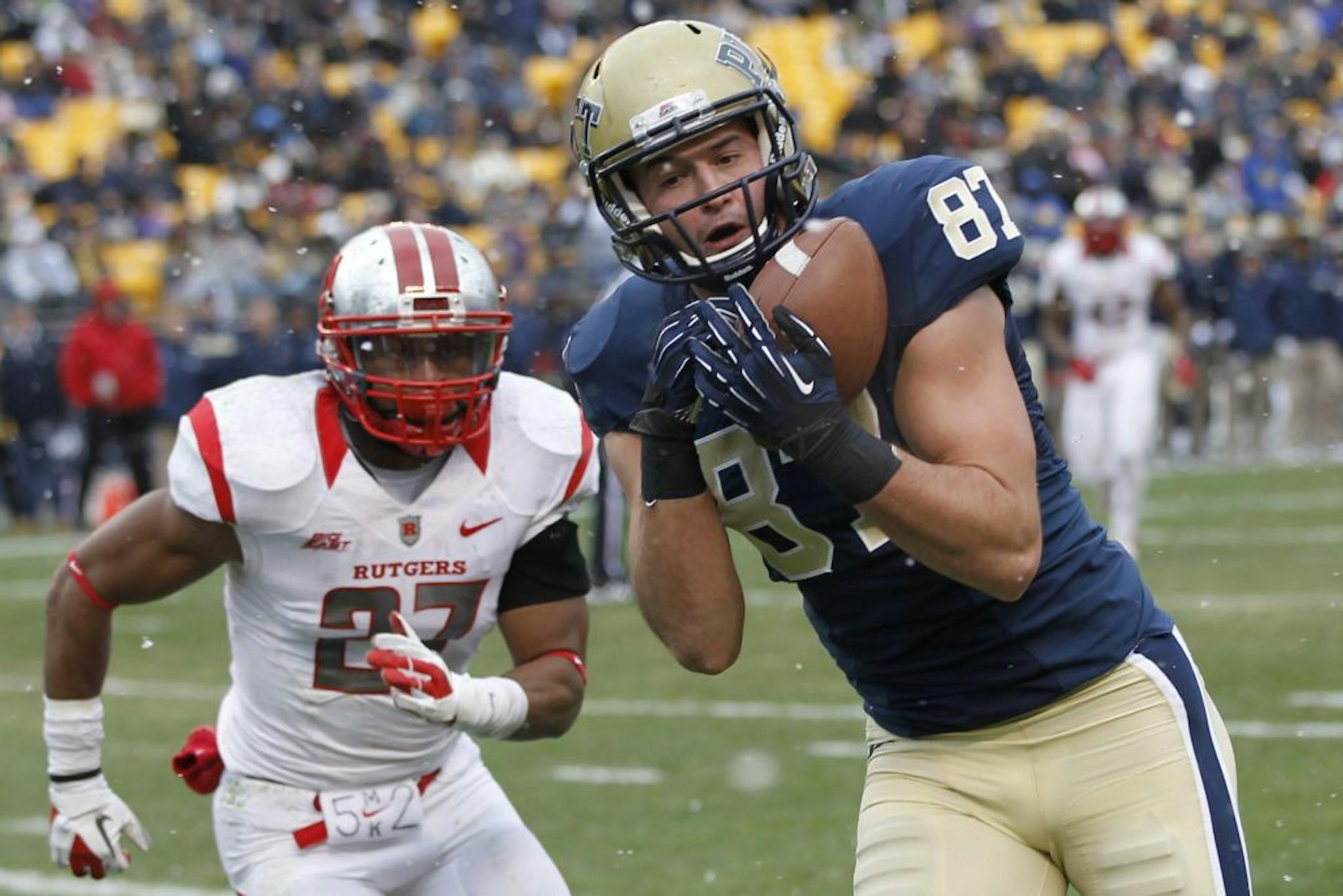 Pittsburgh wide receiver Mike Shanahan (87) grabs a pass in front of Rutgers defensive back Wayne Warren (27) for a touchdown in the second quarter of an NCAA college football game on Saturday, Nov. 24, 2012 in Pittsburgh.