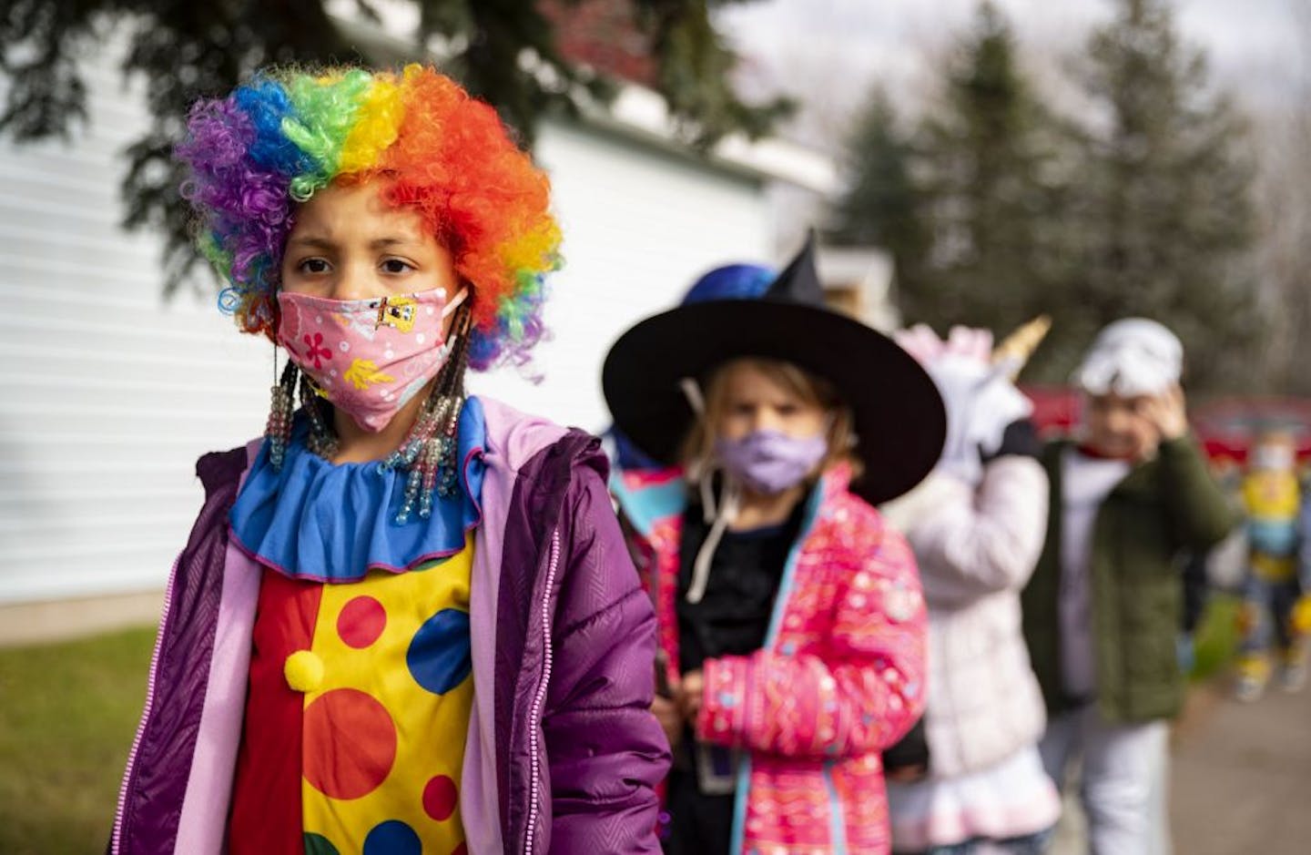 Costumes — and masks — at a Duluth Halloween parade