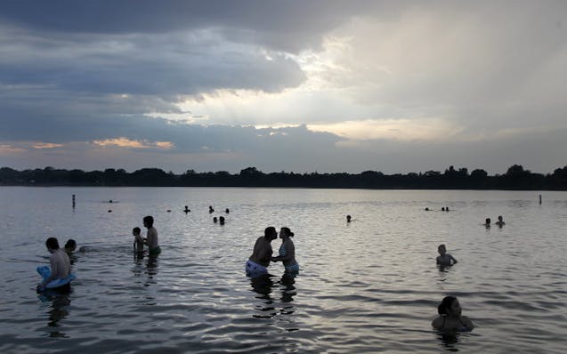 Swimmers enjoy Lake Nokomis.