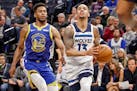 Minnesota Timberwolves guard Shabazz Napier (13) drives to the basket past Golden State Warriors forward Glenn Robinson III (22) in the first half of 