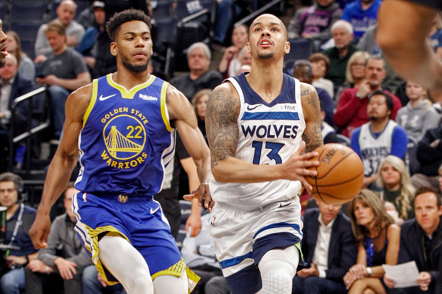 Minnesota Timberwolves guard Shabazz Napier (13) drives to the basket past Golden State Warriors forward Glenn Robinson III (22) in the first half of an NBA basketball game Thursday, Jan. 2, 2020, in Minneapolis. The Timberwolves won 99-84. (AP Photo/Bruce Kluckhohn)