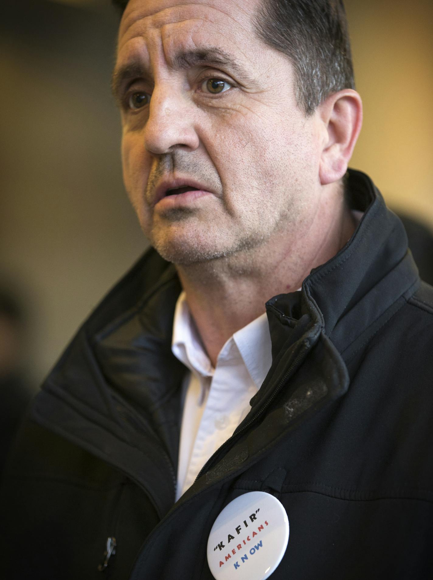 Ron Branstner of St. Cloud wears a button that says "Kafir Americans Know" (the word kafir means a person who is not a Muslim) to attend a talk by Jaylani Hussein, executive director of the Minnesota chapter of the Council of American Islamic Relations of Minnesota (CAIR-MN) about Islamophobia in Minnesota at St. Cloud State University on Tuesday, February 9, 2016. ] (Leila Navidi/Star Tribune) leila.navidi@startribune.com ORG XMIT: MIN1603291606514315