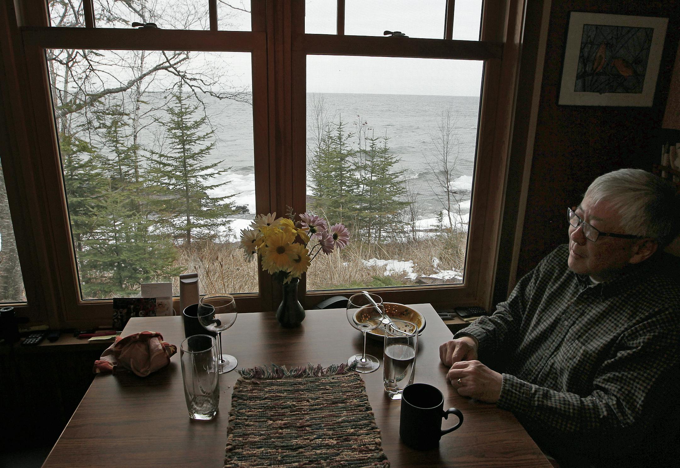 Duane Hasegawa had his coffee with a view of Lake Superior fromhis home, Sunday, April 27, 2014 in Grand Marais, MN. [ (ELIZABETH FLORES/STAR TRIBUNE) ELIZABETH FLORES • eflores@startribune.com
