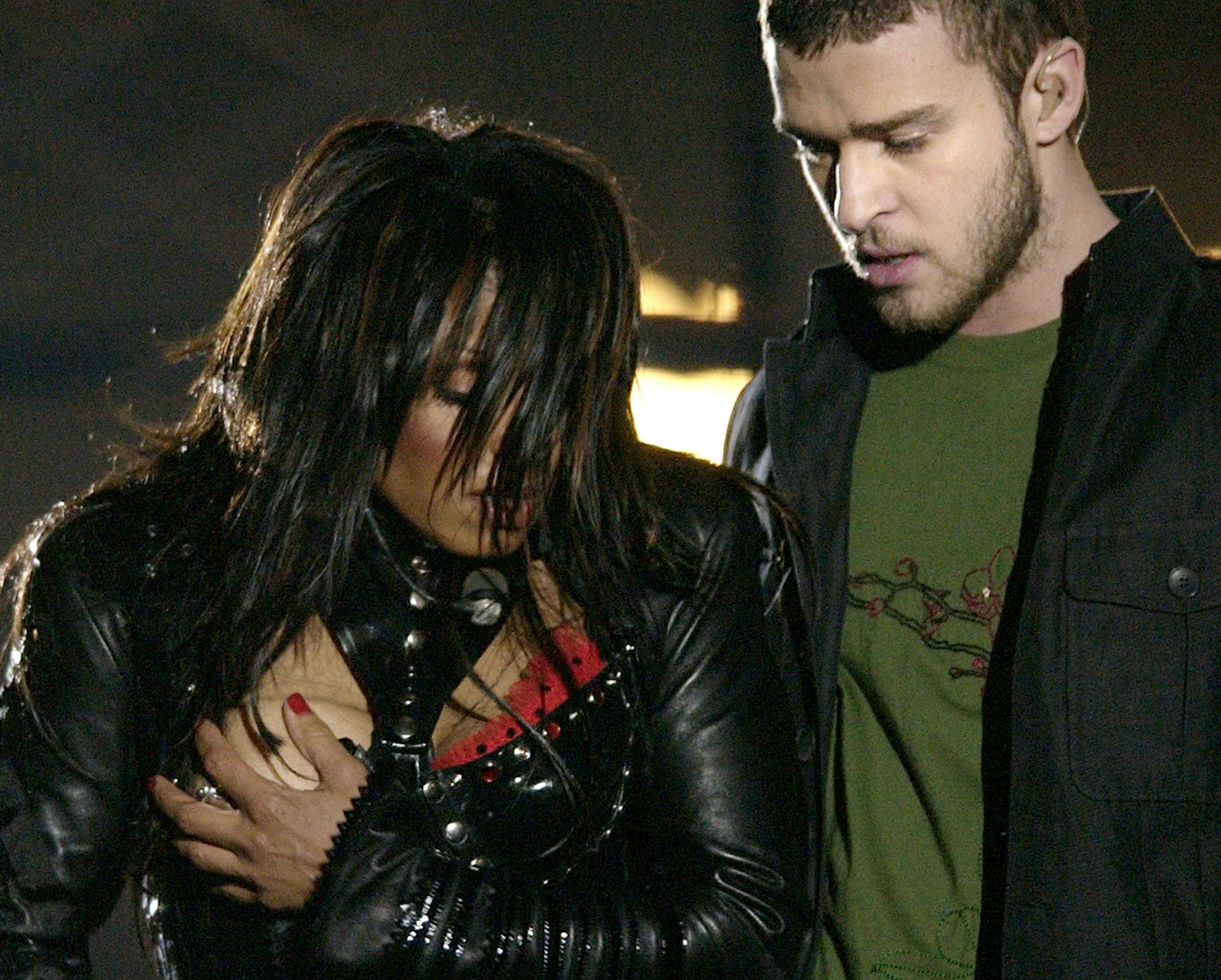FILE - In this Sunday Feb. 1, 2004 file photo, entertainer Janet Jackson, left, covers her breast after her outfit came undone during the half time performance with Justin Timberlake at Super Bowl XXXVIII in Houston. Following Janet Jackson's unanticipated exposure, the NFL ushered in a dinosaur era of big rock acts like The Who, Paul McCartney, Bruce Springsteen and Tom Petty. (AP Photo/David Phillip, File)