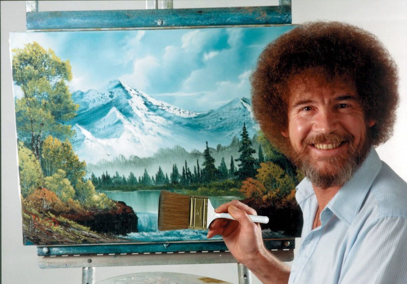 Bob Ross and pne of his paintings.