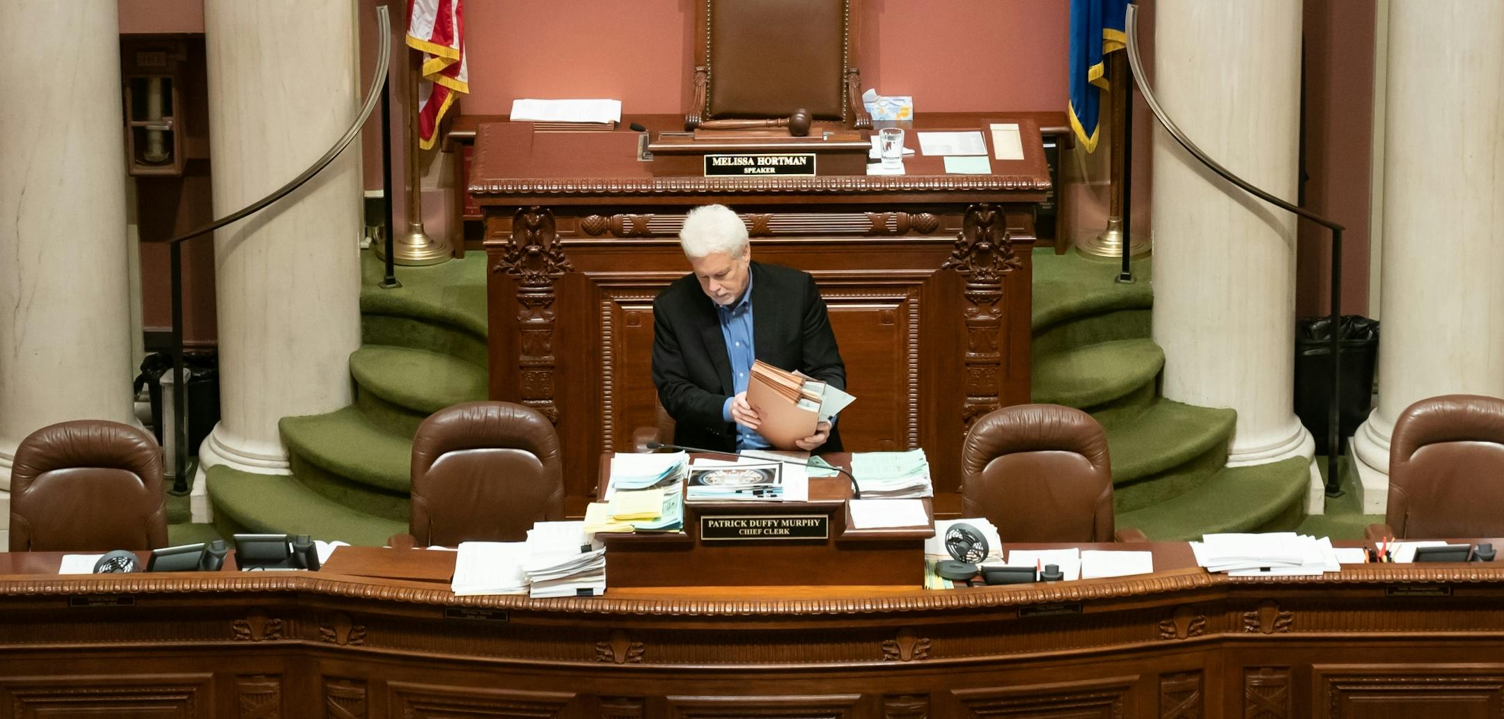 Chief Clerk Patrick Duffy Murphy organized some of the paperwork left on his desk from the night before. A special session still looms to finish much of the work that was not completed before the session came to a close at midnight Monday night.