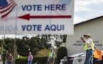Volunteers direct traffic at a polling place on Election Day in Orlando, Fla., Nov. 6, 2018. In ending some of the harshest voting restrictions in the