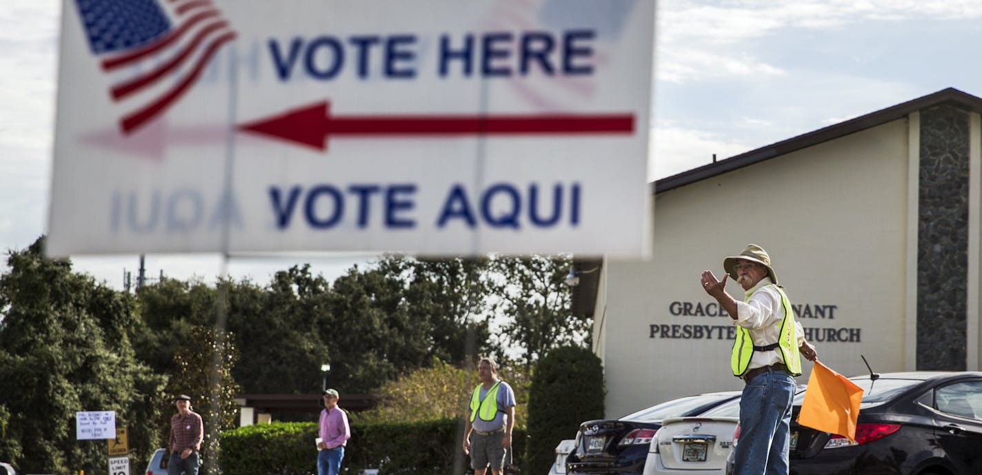 Volunteers direct traffic at a polling place on Election Day in Orlando, Fla., Nov. 6, 2018. In ending some of the harshest voting restrictions in the nation for those with criminal records, Florida voters responded to the argument that people should get another chance. (Scott McIntyre/The New York Times)