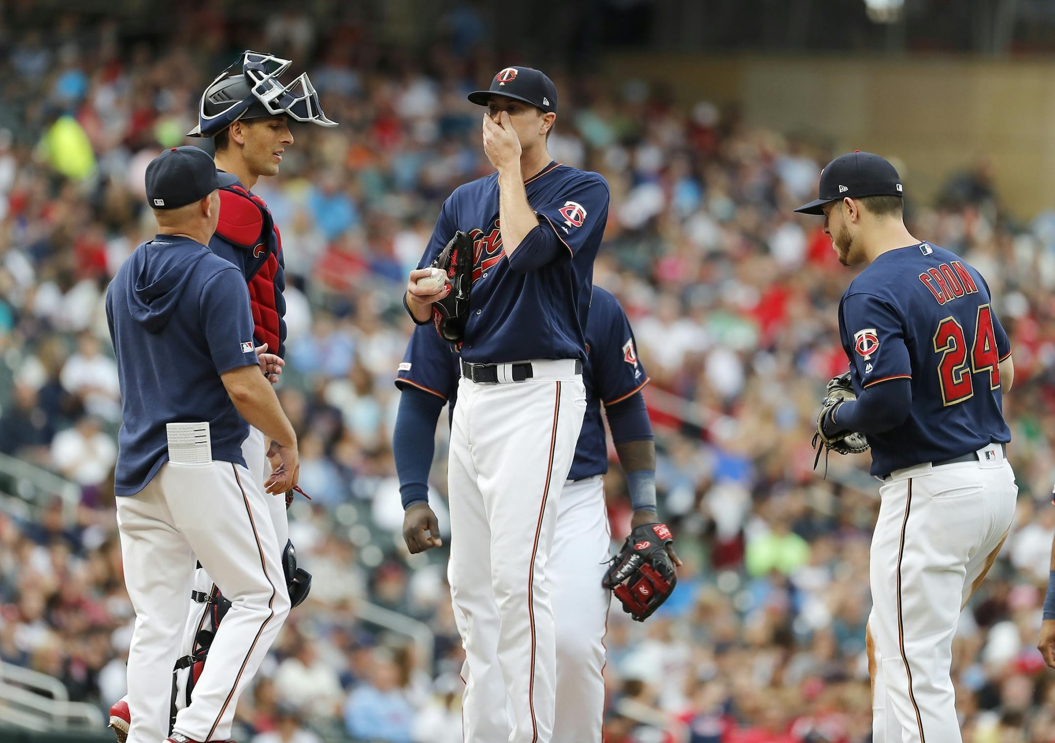 Minnesota Twins starting pitcher Kyle Gibson (44) gets a conference on the mound in the second inning.