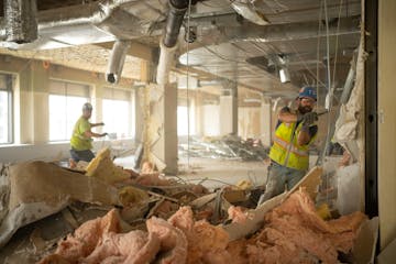 Demolition is underway on the 11th floor in the Northstar Center East project where work has begun to convert the 13 story office building into 216 ap