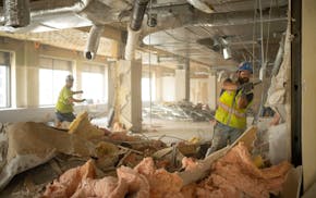 Demolition is underway on the 11th floor in the Northstar Center East project where work has begun to convert the 13 story office building into 216 ap