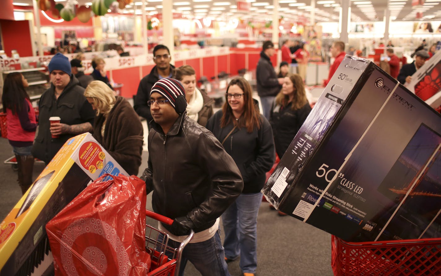 Hundreds of early bargain hunters were in line to enter the Target store at Ridgedale in Minnetonka when it opened at 8 p.m. Thursday night, November 28, 2013. Shoppers headed out with their purchases just 35 minutes after the Ridgedale Target store opened Thanksgiving night. ] JEFF WHEELER &#x201a;&#xc4;&#xa2; jeff.wheeler@startribune.com