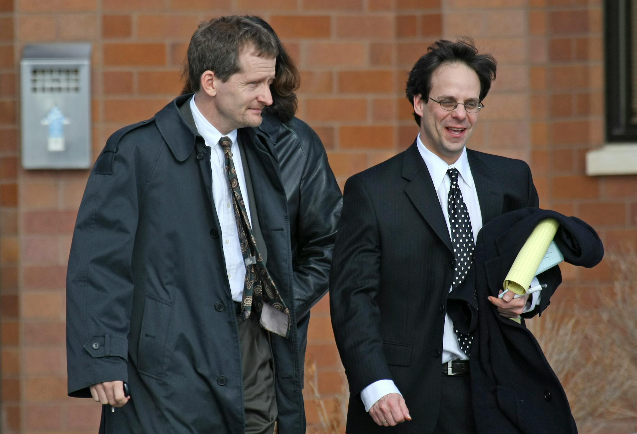 Eric Hawkins, left, and his attorney, Todd Kenyon, left the Sherburne County District Court on Wednesday after a hearing. Hawkins has been charged with two counts of sexual assault.