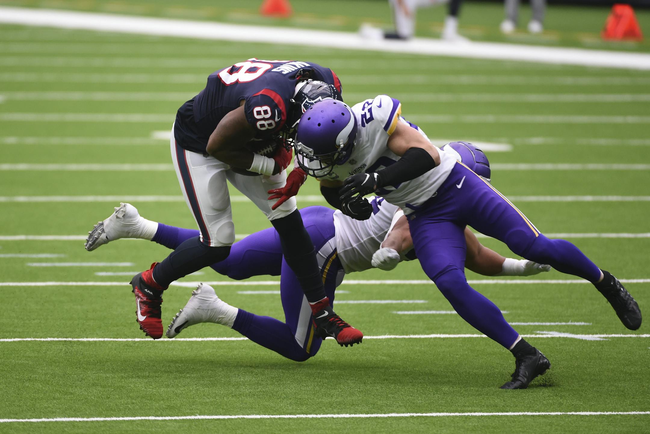 Houston Texans tight end Jordan Akins (88) is hit by Minnesota Vikings strong safety Harrison Smith, right, after catching a pass during the first half of an NFL football game Sunday, Oct. 4, 2020, in Houston. (AP Photo/Eric Christian Smith) ORG XMIT: TXEG1