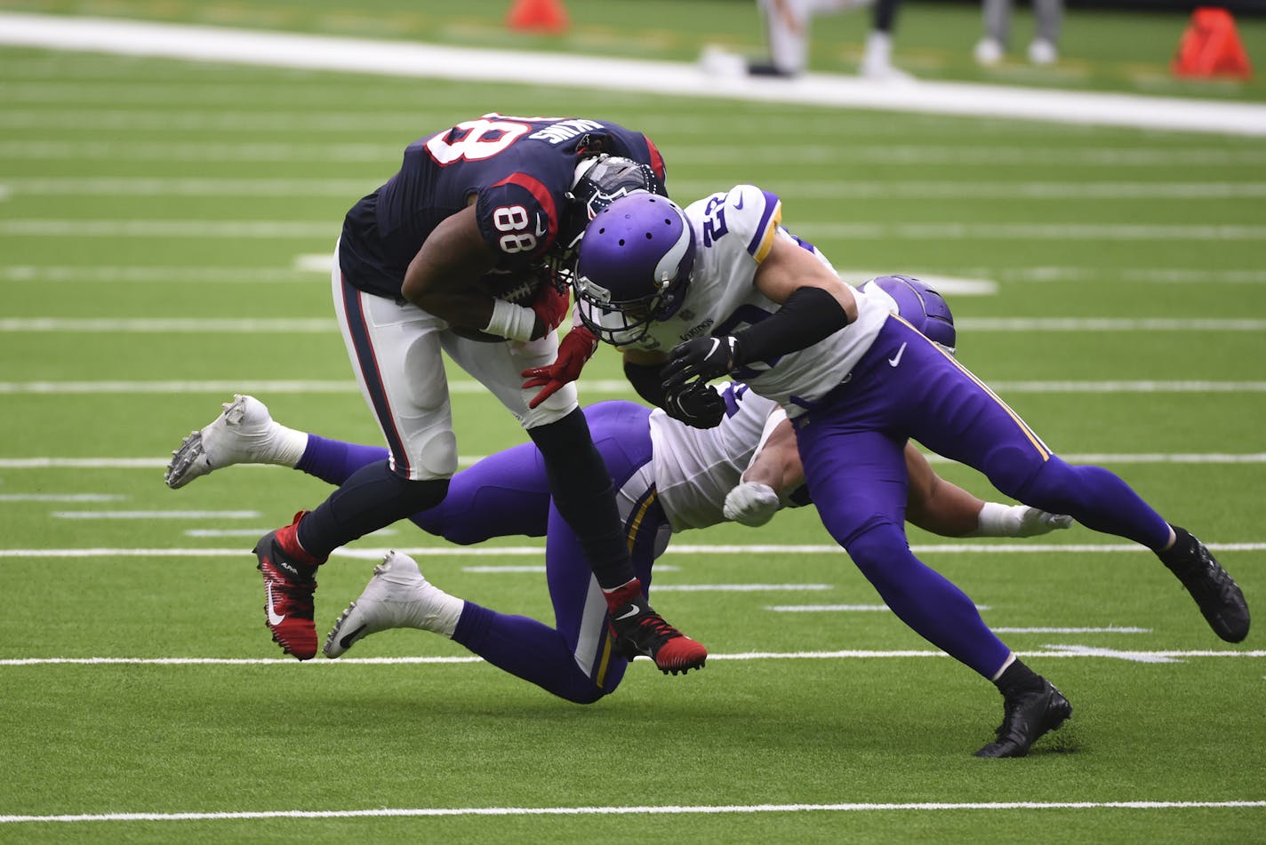 Houston Texans tight end Jordan Akins (88) is hit by Minnesota Vikings strong safety Harrison Smith, right, after catching a pass during the first half of an NFL football game Sunday, Oct. 4, 2020, in Houston. (AP Photo/Eric Christian Smith) ORG XMIT: TXEG1