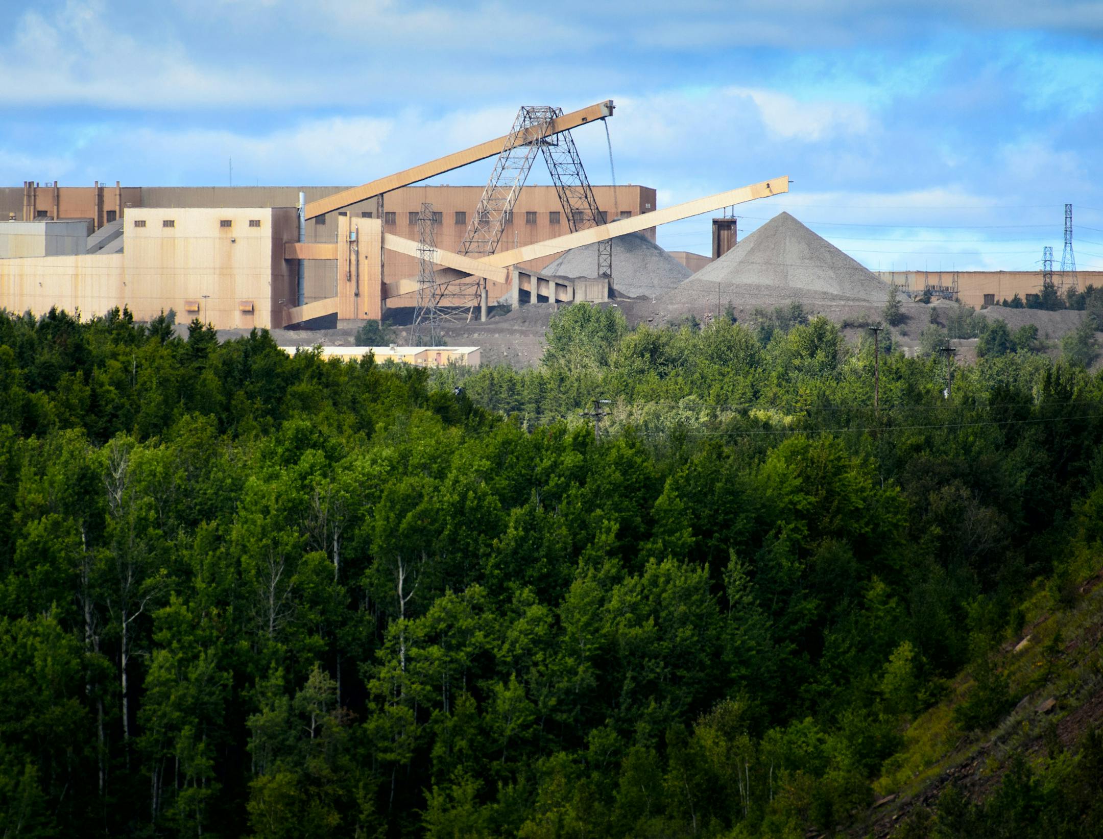 This photo taken Aug. 26, 2014, shows the Minntac taconite mine plant in Mountain Iron, Minn. U.S. Steel plans to idle part of its Minntac plant in Mountain Iron, resulting in layoffs for about 680 workers. (AP Photo/Star Tribune, Glen Stubbe) MANDATORY CREDIT; ST. PAUL PIONEER PRESS OUT; MAGS OUT; TWIN CITIES LOCAL TELEVISION OUT