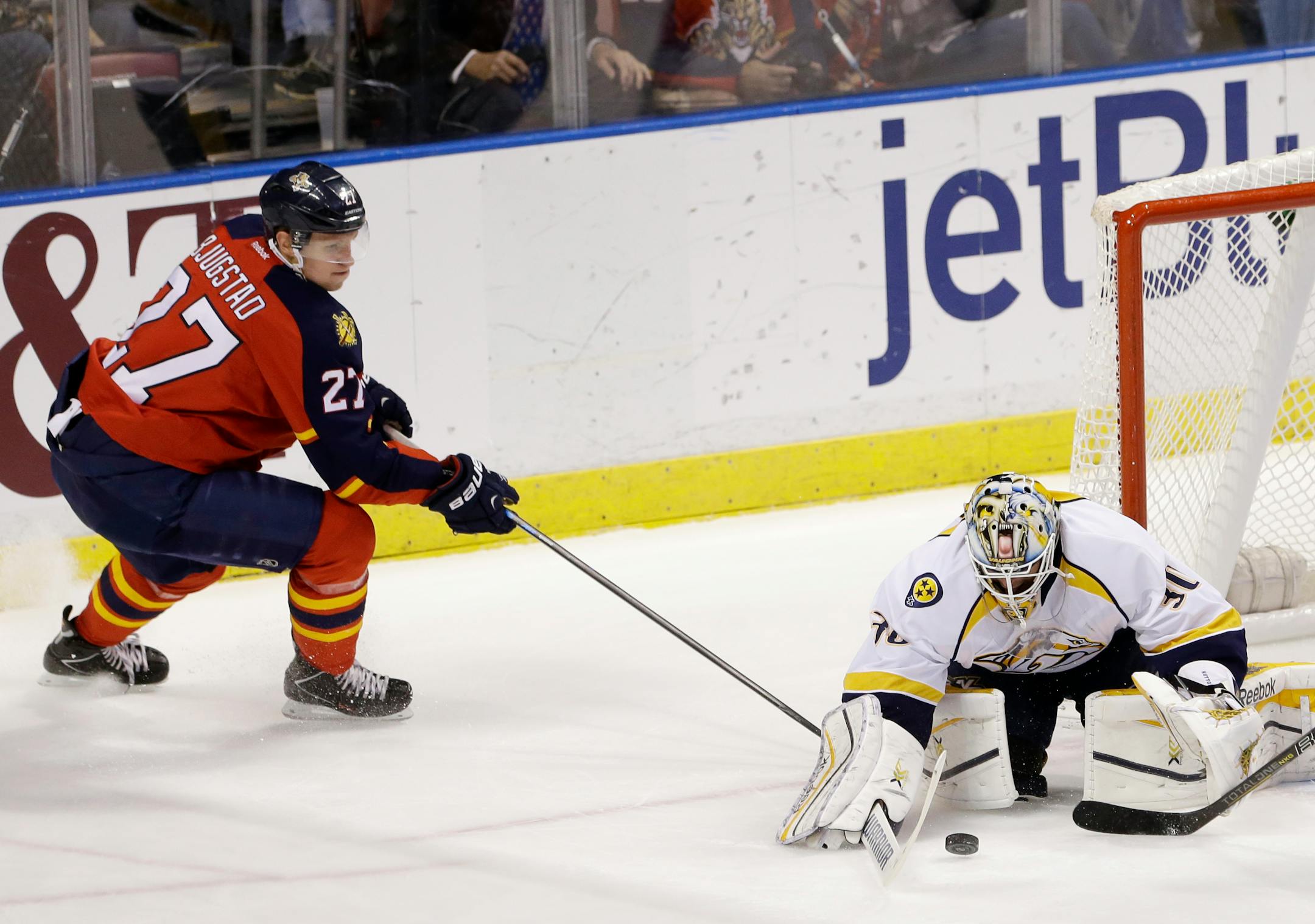 Nashville Predators goalie Carter Hutton (30) makes a save on an attempt by Florida Panthers center Nick Bjugstad (27) during the first period of an NHL hockey game, Sunday, Feb. 8, 2015, in Sunrise, Fla. (AP Photo/Wilfredo Lee)