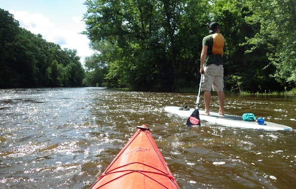 Photo by Lisa Meyers McClintick. Zac Meers paddles the Mississippi River near the Beaver Islands south of St. Cloud.