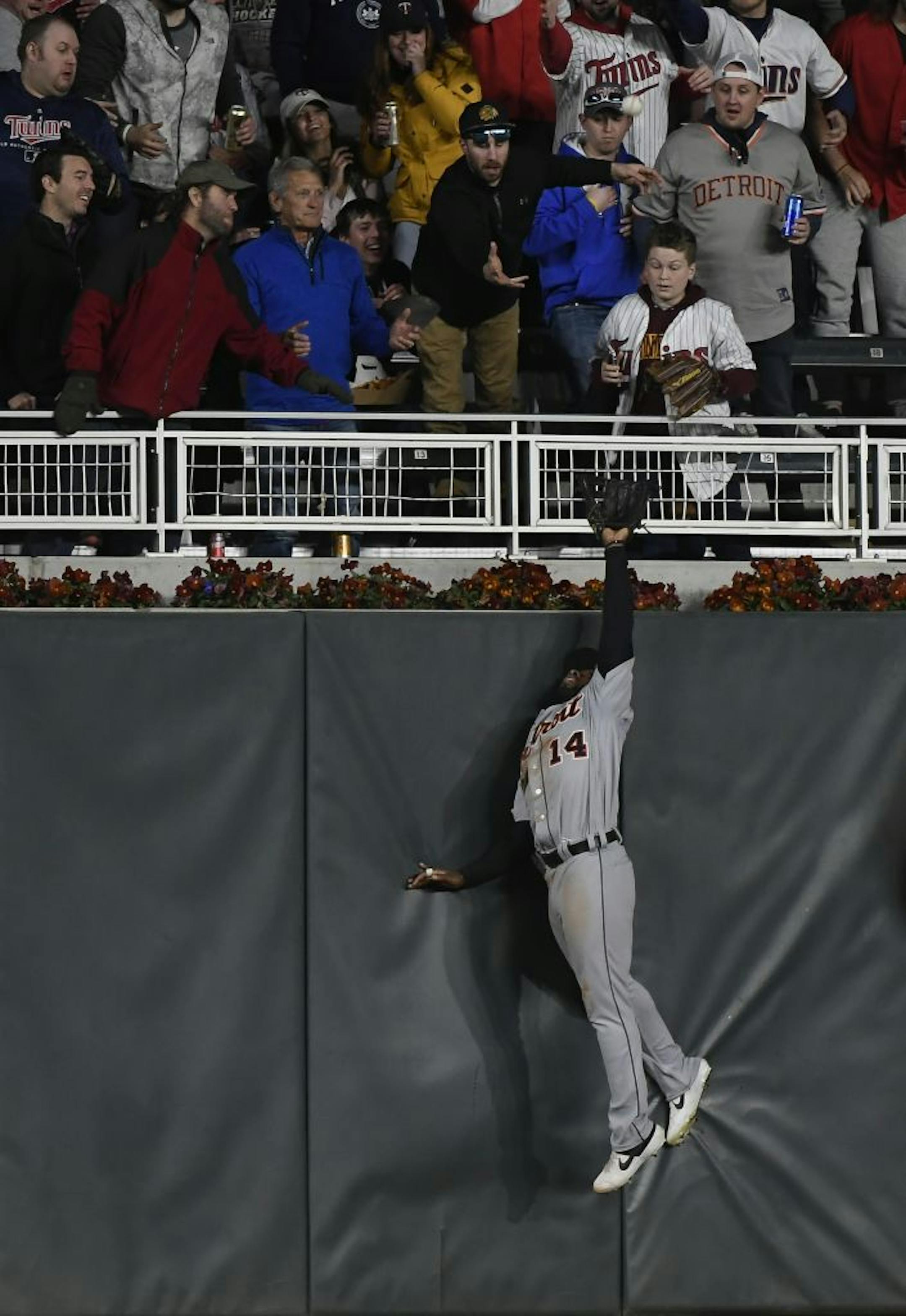 Detroit Tigers left fielder Christin Stewart (14) was unable to catch a home-run ball hit by Minnesota Twins third baseman Marwin Gonzalez (9) in the bottom of the sixth inning.
