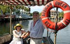 Patricia Myer, a visitor from Miami, and Capt. Wayne held the tiller of the African Queen as it toured a Key Largo, Fla., canal.