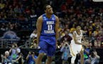 Middle Tennessee State's Edward Simpson (11) reacts after making a three-point basket during the first half of an NCAA college basketball tournament f