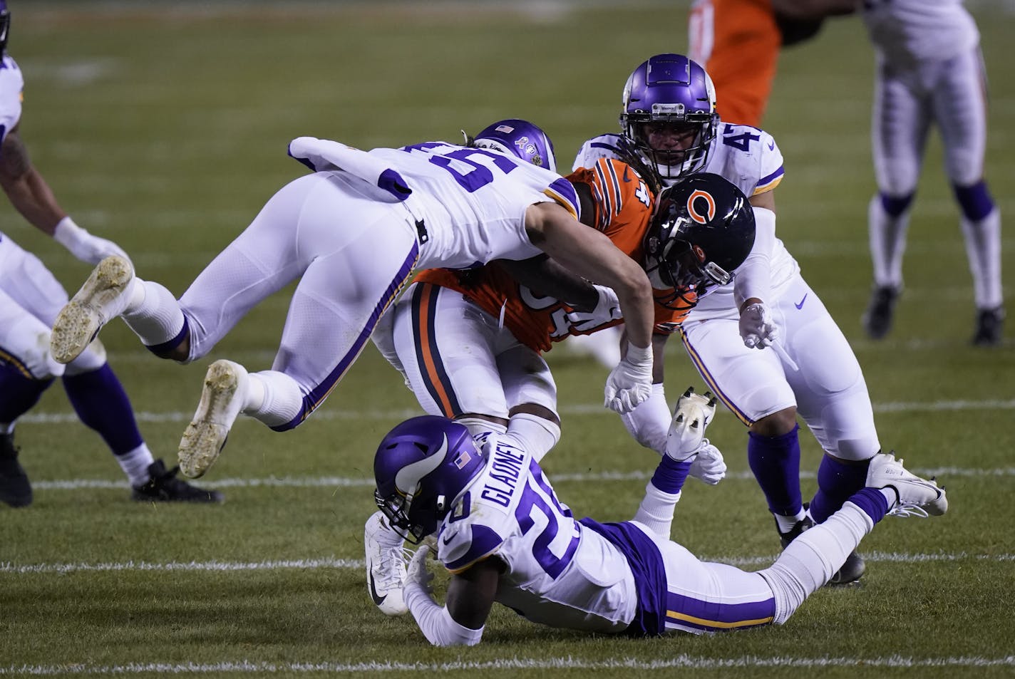 Chicago Bears wide receiver Cordarrelle Patterson is tackled by a host of Minnesota Vikings during the second half of an NFL football game Monday, Nov. 16, 2020, in Chicago. (AP Photo/Nam Y. Huh)