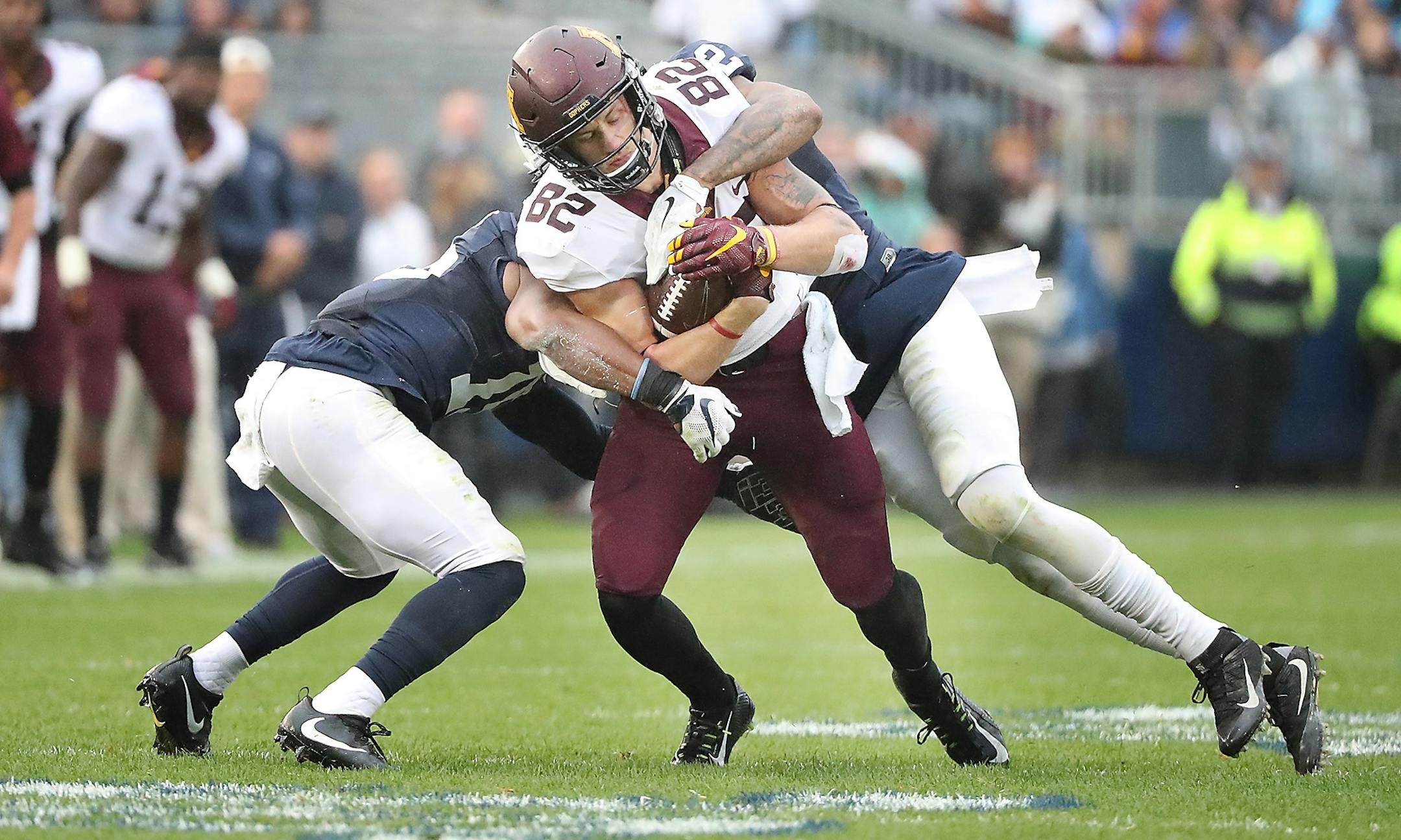 Gophers wide receiver Drew Wolitarsky carried the ball through Penn State cornerbacks Grant Haley, left, and Marcus Allen in the second quarter Saturday in State College, Penn.