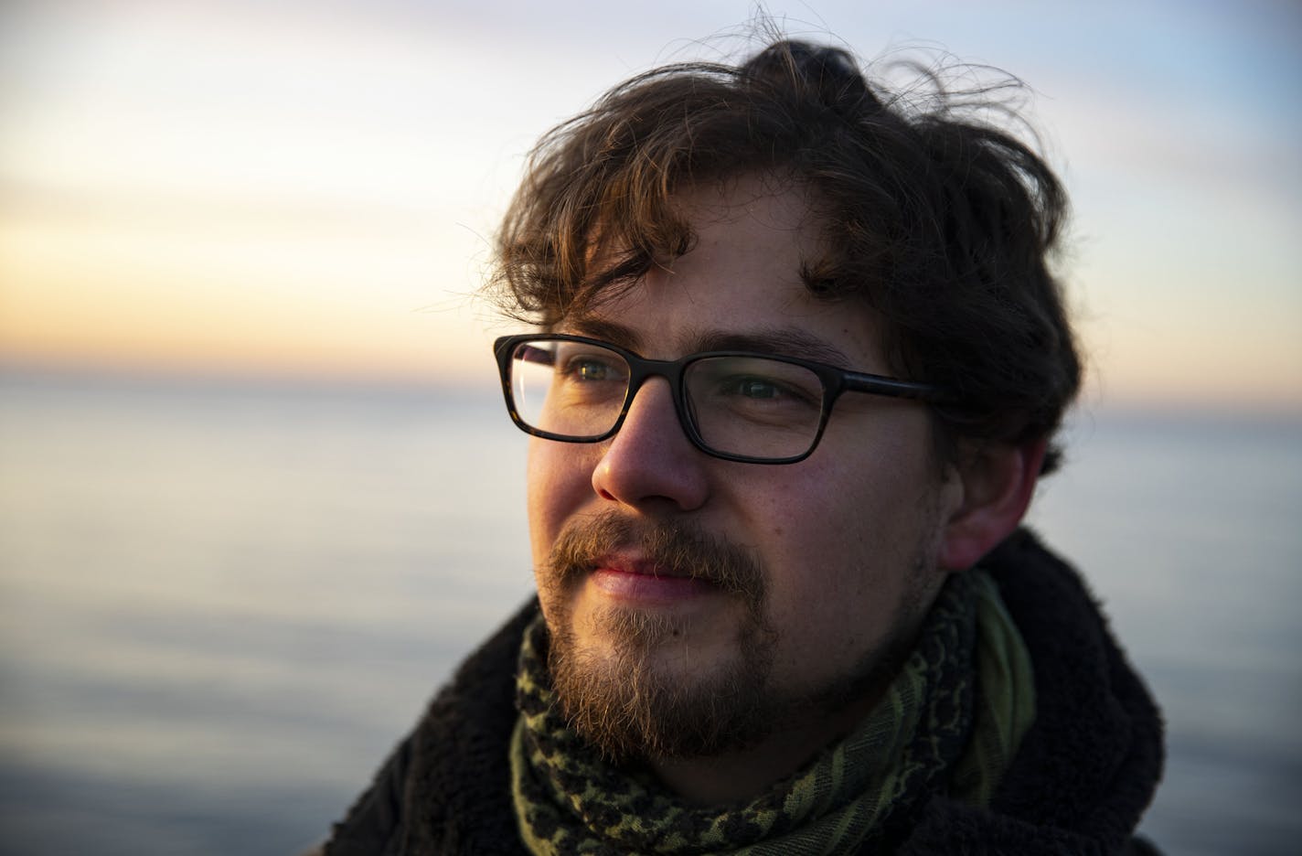 Alex Messenger posed for a portrait on some rocks in Brighton Beach at sunrise on November 7, 2019. Lester was on a canoeing trip when he was attacked by a Grizzly bear 15 years ago. He feels an elemental connection to water because of that.]
ALEX KORMANN &#x2022; alex.kormann@startribune.com Alex Messenger survived a bear attack fifteen years ago in the Canadian Arctic. His experience has greatly impacted his life and soon he will be releasing a book titled "The Twenty-Ninth Day" recounting his