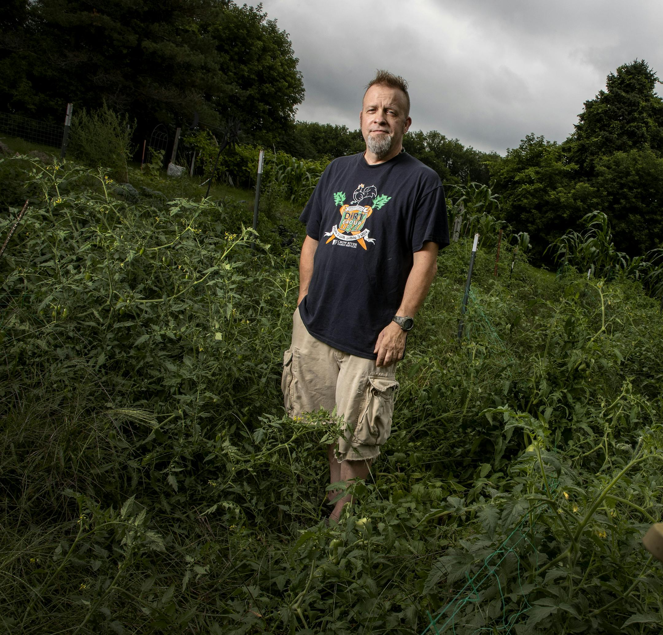 Kenny Turck photographed in his garden near Litchfield, MN. ] CARLOS GONZALEZ • cgonzalez@startribune.com – Litchfield, MN – August 13, 2020, Kenny Turck has a moving story about his love of gardening. When he was young, his sister, who was gay and ostracized, committed suicide. That tragedy launched him on his life's path, which is to help young people who're struggling with mental, emotional or other issues, through gardening, or ecotherapy.