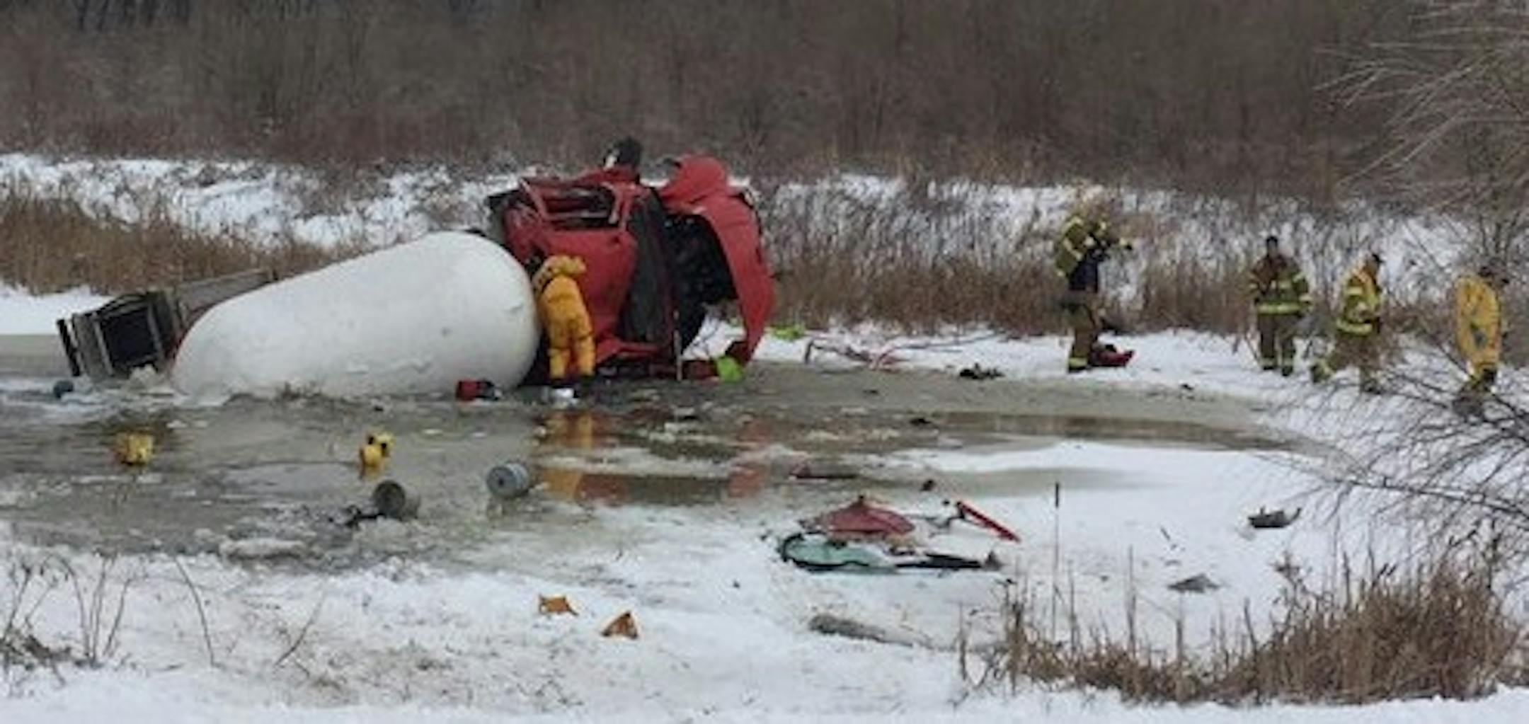 This truck slid into a retaining pond near I-35 in Lakeville.
